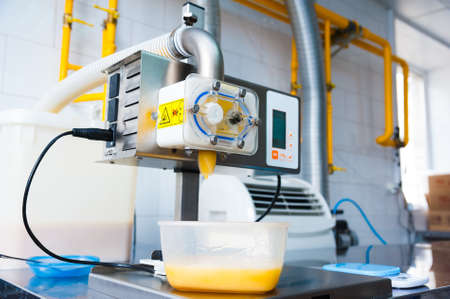 Jars full of organic honey. Production in factoryの写真素材
