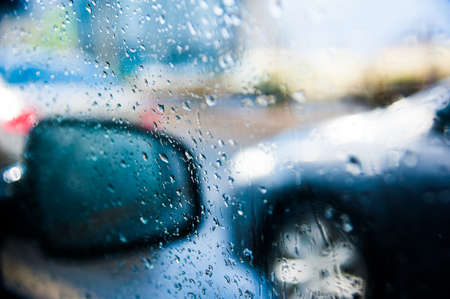 Drops on the surface of the car mirror in very rainy weatherの写真素材