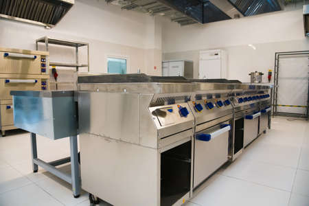 Empty restaurant kitchen with professional equipment. Professional oven in the industrial kitchenの写真素材