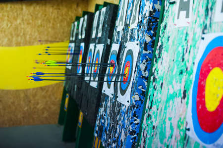 Archery. Arrows in archery target on archery rangeの写真素材