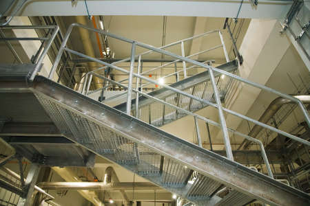Grain processing facility inside. Industrial factory silos and equipment for food productionの写真素材