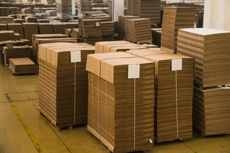 The cardboard is neatly placed in a stack for further useの写真素材