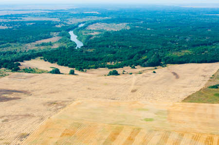 Aerial view of fields and meadows during a summer dayの写真素材