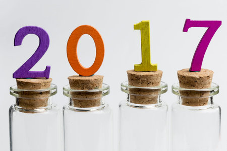 Glass flasks on a white background with numbers 2017.
