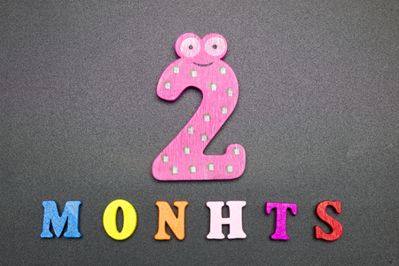 Two months on a black background.の写真素材