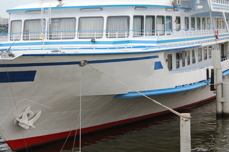 The ship is on the dock by the river.の写真素材