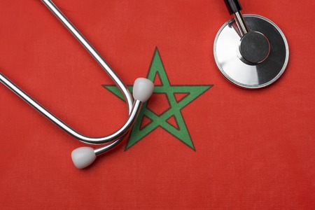 Morocco flag and stethoscope. Stethoscope on the flag as a background.の写真素材