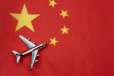 The flag of China and the plane.の写真素材