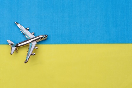 Flag of Ukraine and the plane.の写真素材