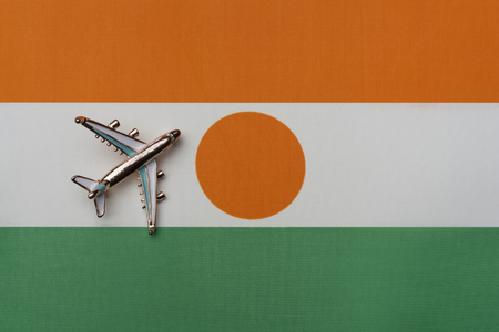 Plane over the flag of Nigeriaの写真素材