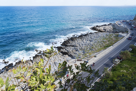 The sea waves splashing on a stony beachのeditorial素材