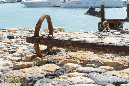 Ring from the old rusty anchor in port.の写真素材