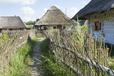 Old houses with thatched roofs in summer Sunny day.の写真素材