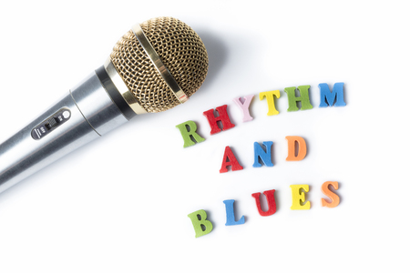 Microphone on a white background with the words the RHYTHM and BLUES of multi-colored letters.の写真素材