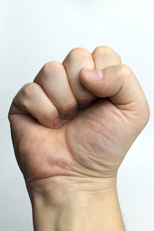 Human's hand on white background. Fistの写真素材