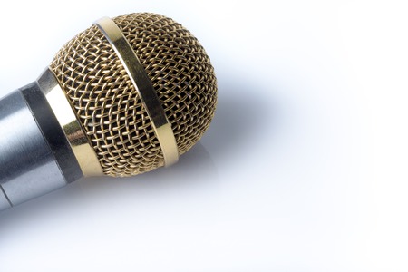 Microphone on a white background close-up with gold plating.の写真素材