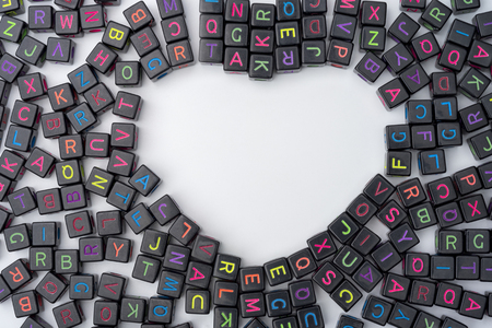 Lots of colorful decorative cubes with letters on white background. The concept of studying or writing.の写真素材