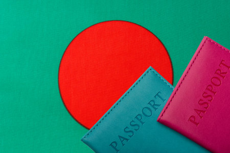 On the background of the Flag of Bangladesh are passport. Travel and tourism concept.