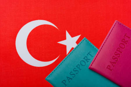 On the background of the Flag of Turkey are the passport. Travel and tourism concept.の写真素材