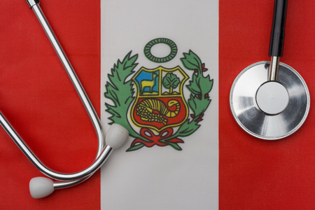 Peru flag and stethoscope. The concept of medicine. Stethoscope on the flag in the background.の写真素材