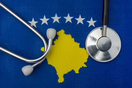 Kosovo flag and stethoscope. The concept of medicine. Stethoscope on the flag in the background.の写真素材
