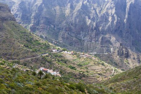 Mountain road on the island of Tenerife, high mountains and dense forests. The concept of tourism and recreation.の写真素材