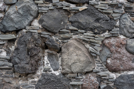 The stone texture of the wall or track. Beautiful stone texture, design project.