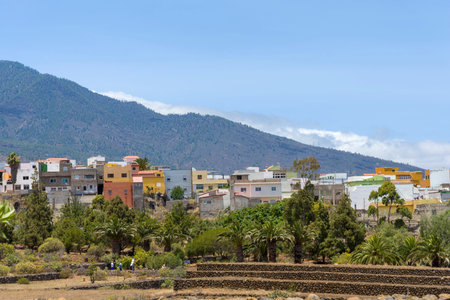 Mountains, fog, houses on the island of Tenerife. Travel and tourism concept.
