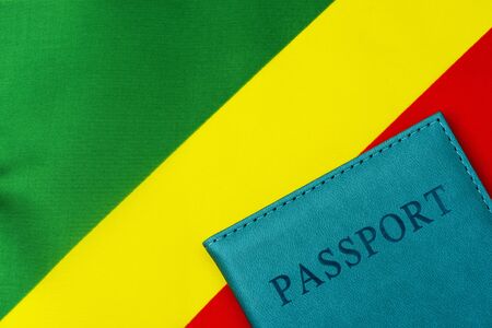On the background of the flag of the Republic of Congo is a passport. The concept of travel and tourism.の写真素材