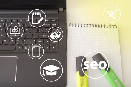 Seo and icons, the concept of development of the system. Information icons on the background of a computer and a person.の写真素材