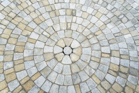 Stone paving circle texture. Abstract structured background of modern street pavement slabs pattern. Stone tile.の写真素材