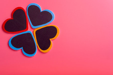 Four hearts on a pink background. Concept of Valentine's day and mother's day. The concept of love and loyalty.の写真素材