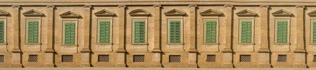 Windows of houses of old houses of Rome in Italy. Beautiful building.の写真素材