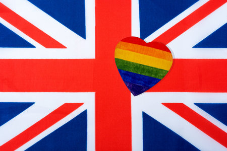 The flag of Great Britain and the heart in the form of the LGBT flag. The concept of lesbian, gay,...