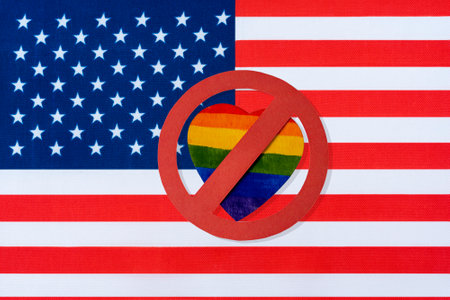 the flag of America and the ban on LGBT people. Crossed out red circle of the heart in the form of the Lgbt flag.の写真素材