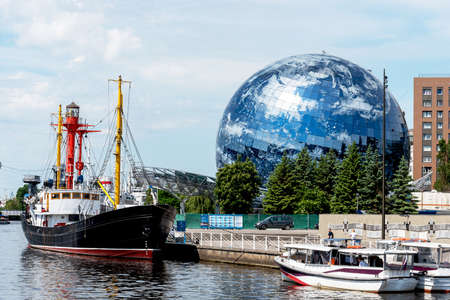 Kaliningrad, Russia, June 5, 2021. The museum exposition of the ship. An exhibit of the World Ocean Museum. The embankment of the Maritime Museum. The building of a round sphere.のeditorial素材