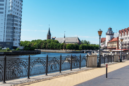KALININGRAD, RUSSIA-JUNE 5, 2021 Fishing village, with a view of the cathedral. The concept of...