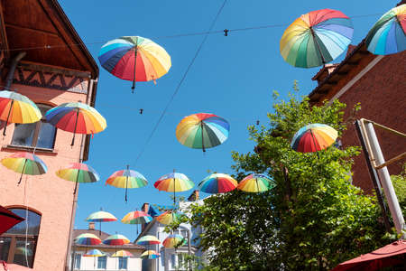 There are many colorful umbrellas in the sky. The concept of fun and joy.の写真素材