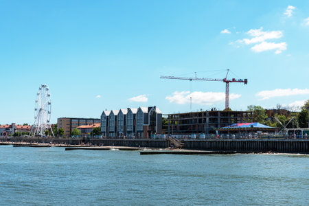 Zelenogradsk, Kaliningrad Region, Russia, June 2021. The coastal resort line of the city. A new Ferris wheel. Many people relax on the beachのeditorial素材
