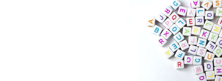 Many decorative white cubes with letters on a white background. Copy Space.の写真素材