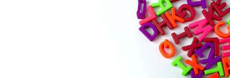 Wooden colored letters on a white background in various places. Copy Space.の写真素材