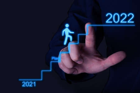 The businessman points to a growing success plan until 2022. The concept of business promotion.の写真素材