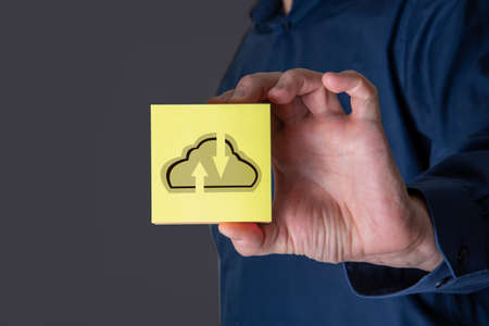 Businessman hand holding cloud computing online connecting to big data analytics. Block chain network technology and intelligence data storage develop smart decision in global business solution.の写真素材