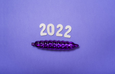 2022 on a lilac background with a view from above. The concept of a holiday, a new year.
