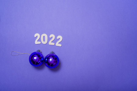 2022 on a lilac background with a view from above. The concept of a holiday, a new year.