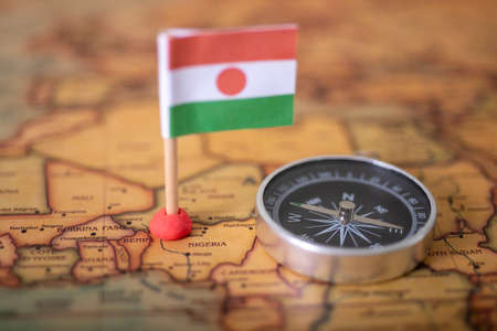 Niger flag and compass on the world map. The concept of travel and recreation in Nigeriaの写真素材