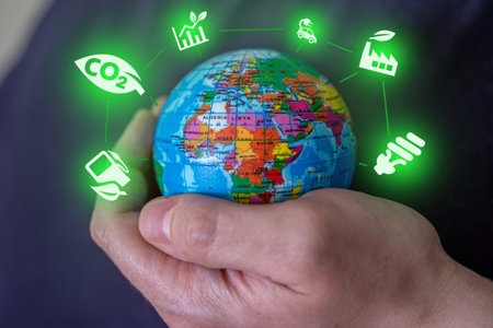 The hand of man holds the planet earth. The concept of ecological protection of the planet earth holding in our hands.の写真素材