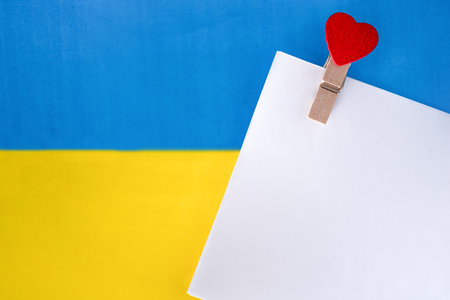The flag of Ukraine and the white sheet. The concept of peace in Ukraine.の写真素材