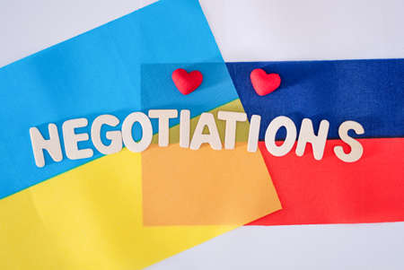 flag of Ukraine and Russia, negotiations. The concept of negotiations on the settlement of the conflict between Urkaine and Russia.の写真素材