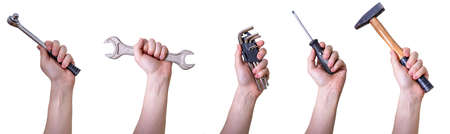 Male hands with different repair tools on white background. Collage of hands with hand tools.の写真素材